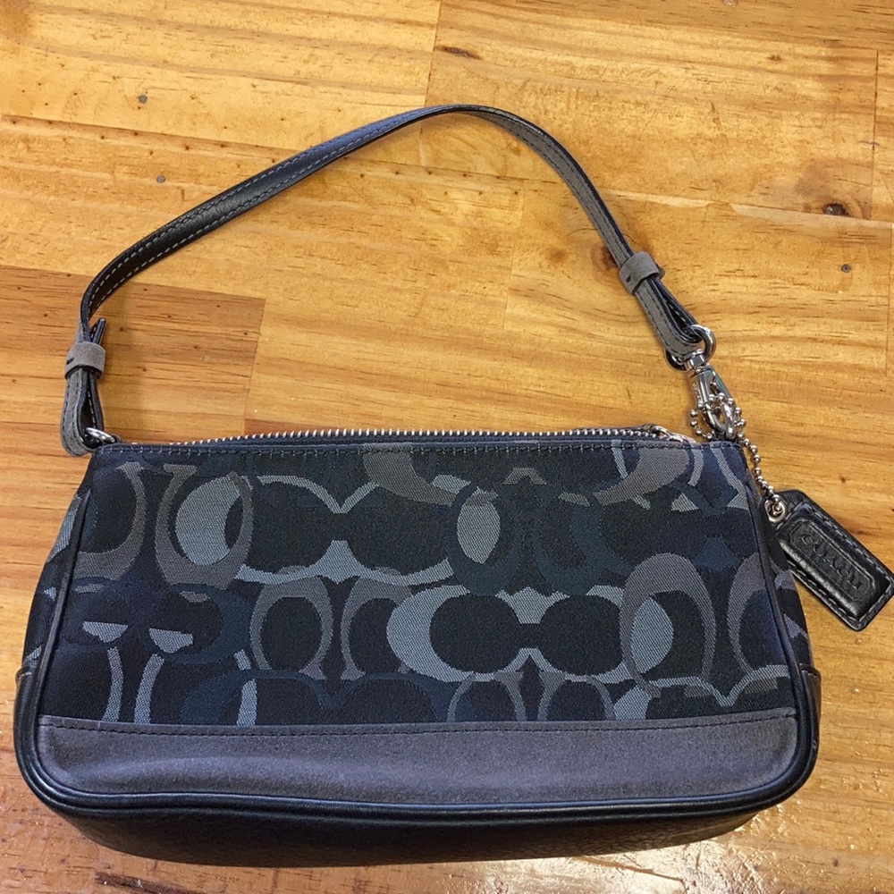 Sleek and Chic, Solid Black Coach Handbag